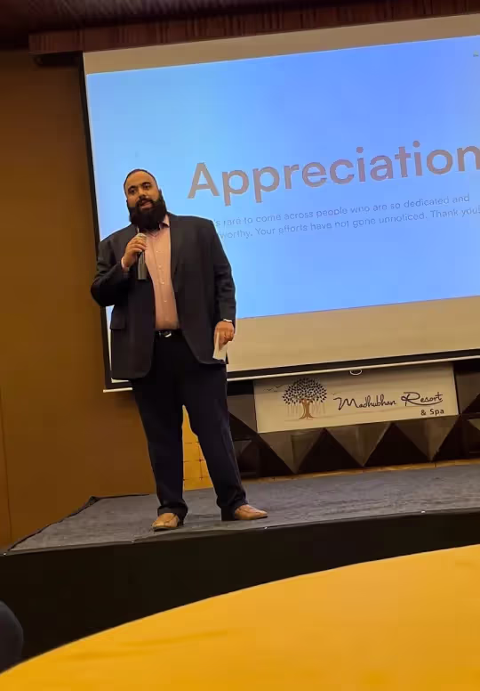 Alchemy Tech team member giving an appreciation speech at a company event